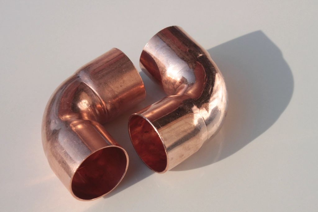 Two new copper elbow fittings